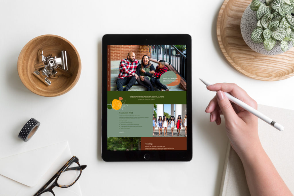 A person holds an apple pencil with a photographer website displayed on the ipad