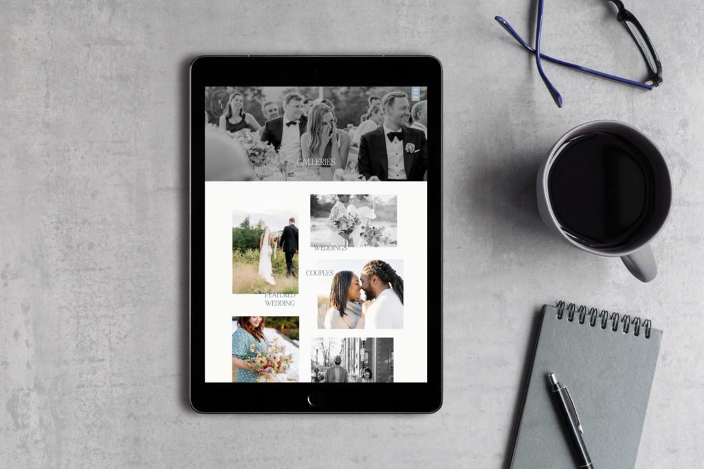 An ipad has a wedding photographer website pulled up, showing couples in love.