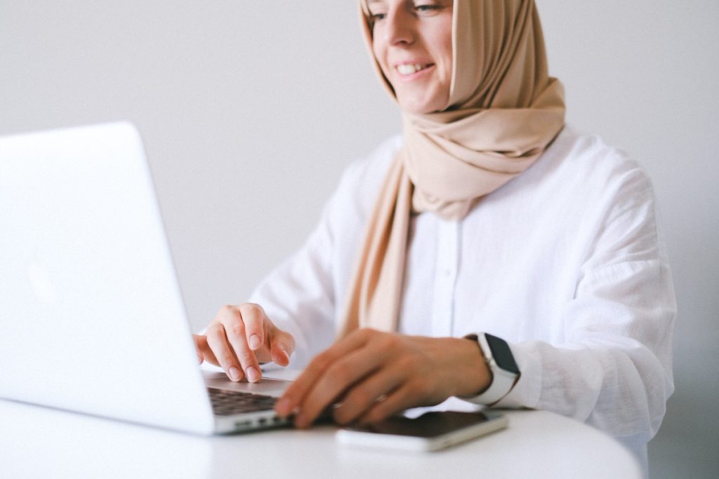 Person smiling while on the computer