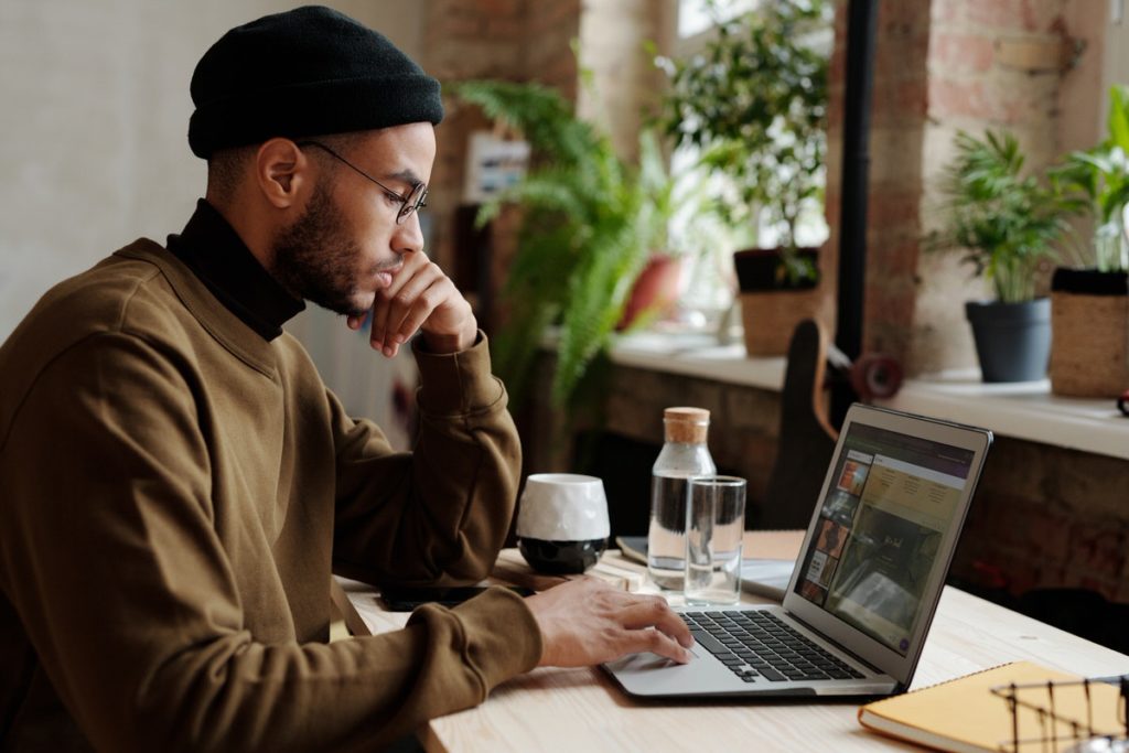 Man working at a desk on his laptop