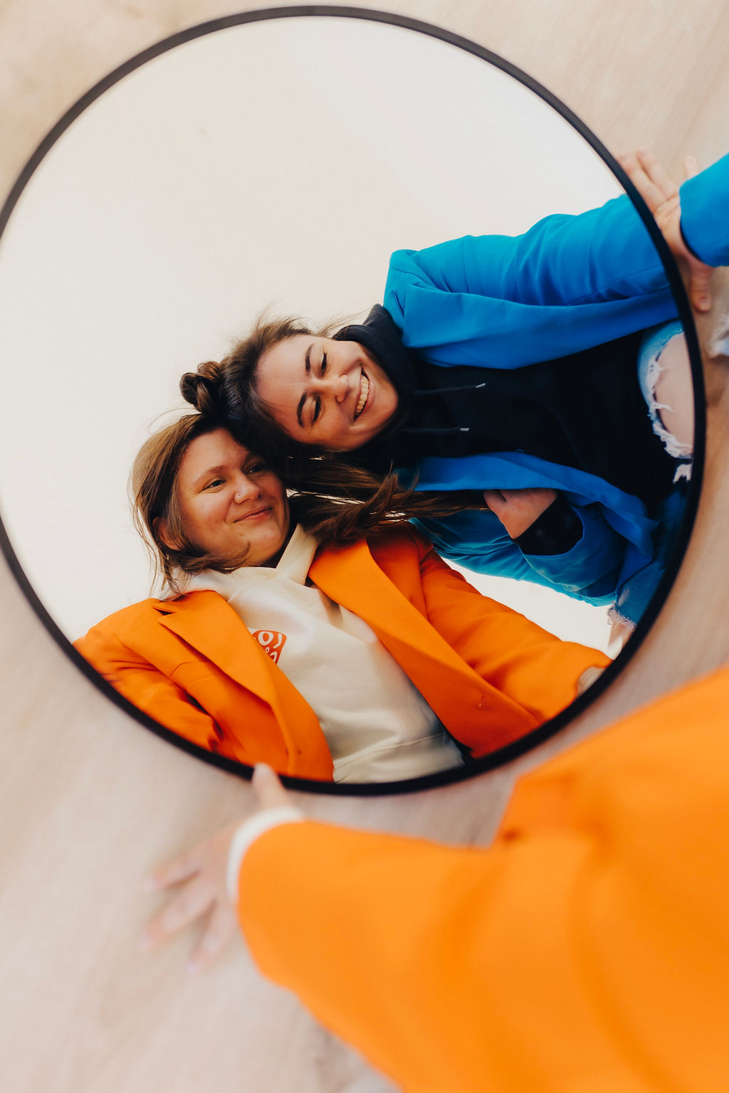 best blogging tools for beginners featured image showing the reflection of two women in bright colored blazers in a mirror