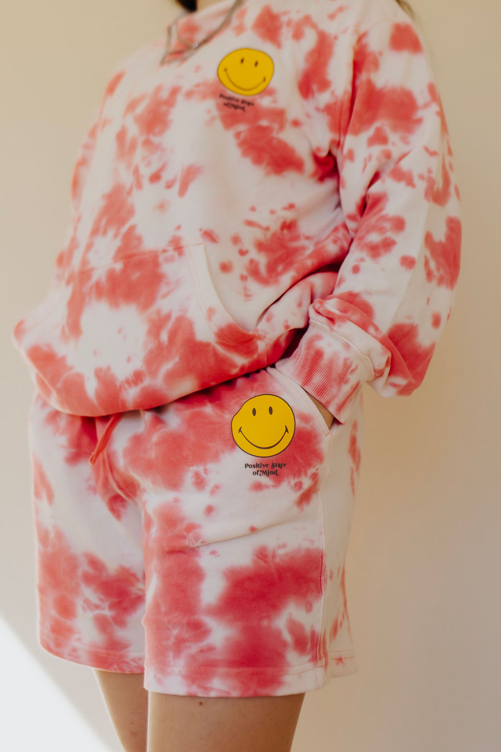 How to Write a Blog Post Fast featured image showing a person in a matching pink tie dye sweat suit with their hands in their pocket