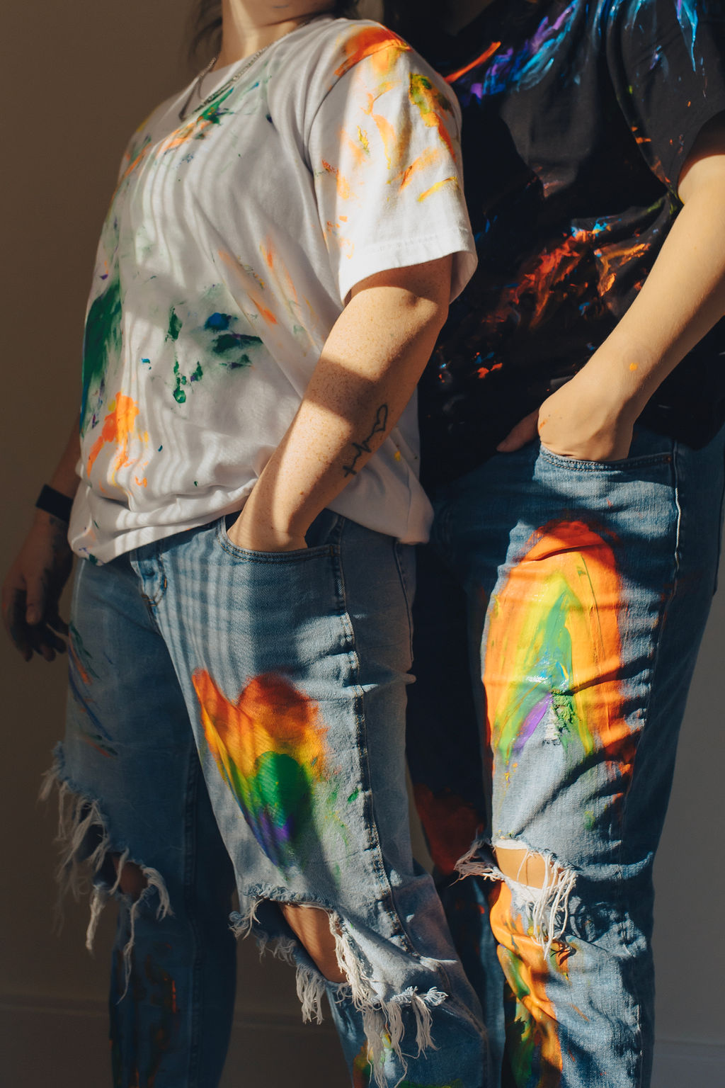 Brand photography for Inkpot Creative, of two people standing next to each other covered in paint.