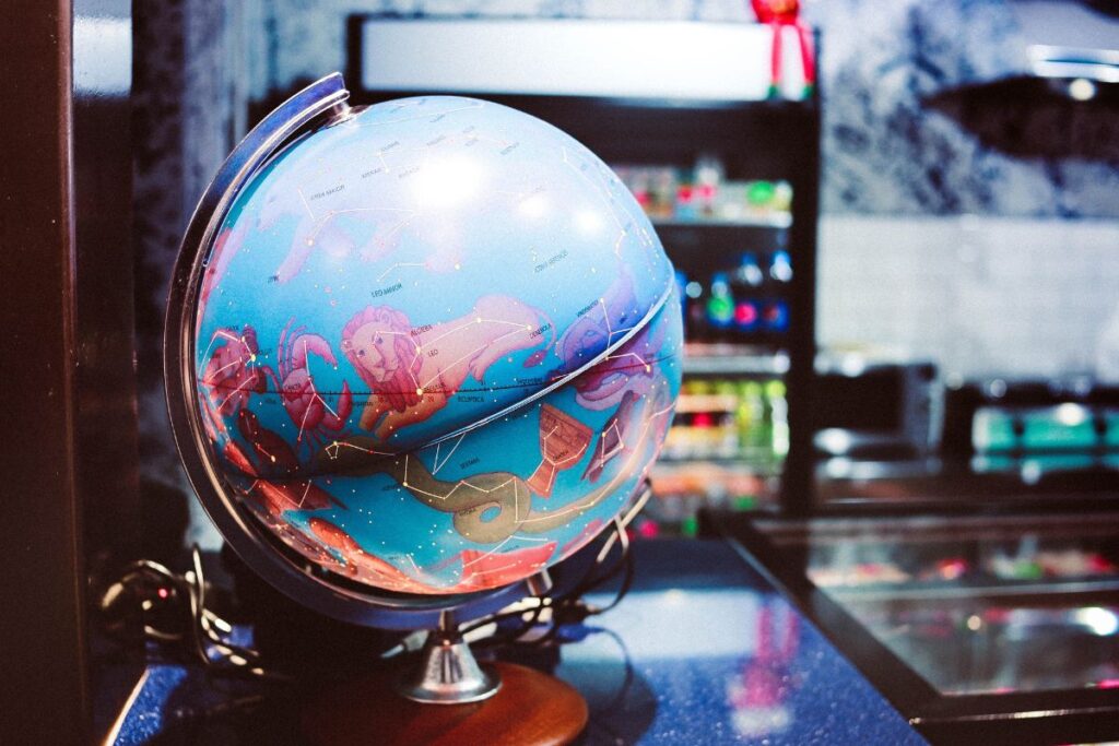 A globe sitting on a counter. 
