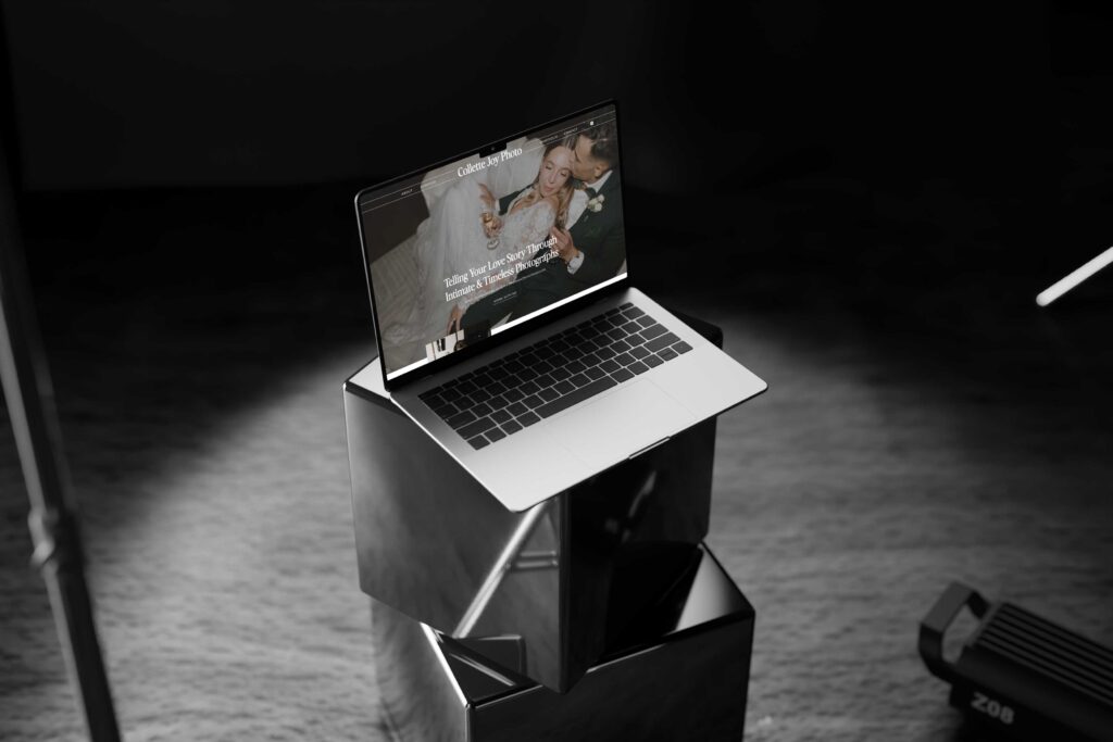 Professional photography website on a laptop with dark aesthetic, highlighting the storytelling aspect as a key sign for needing a new website