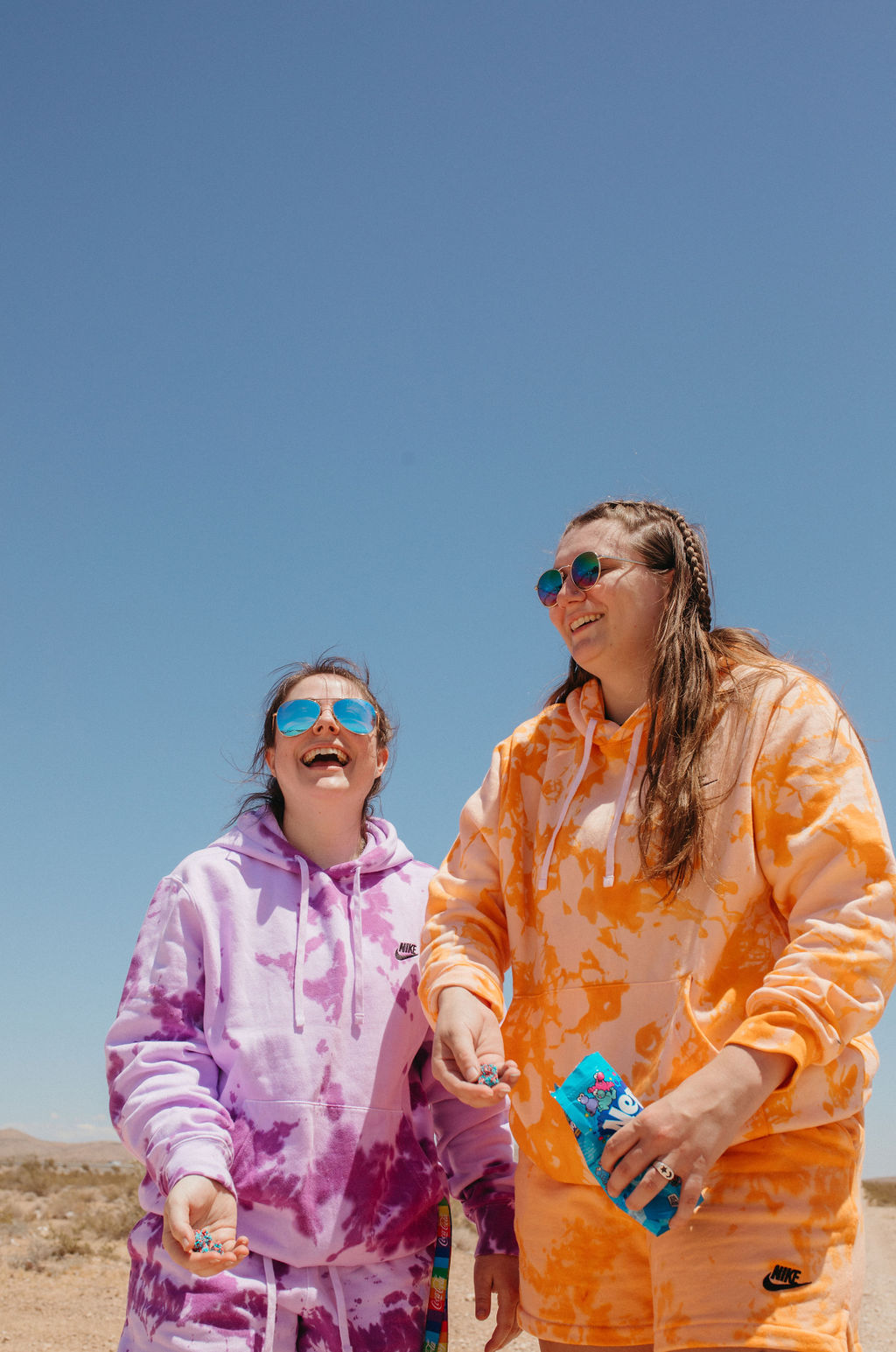 Two girls in the desert in tie dye sweat suits