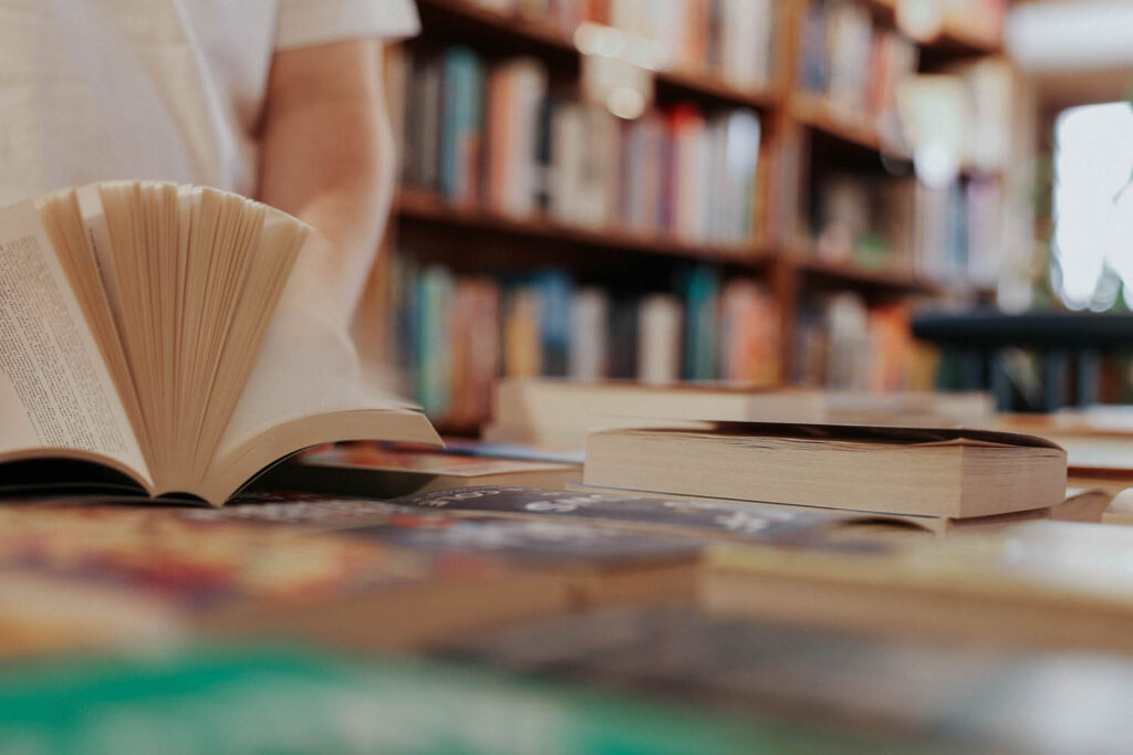 Jessie flips through a book.