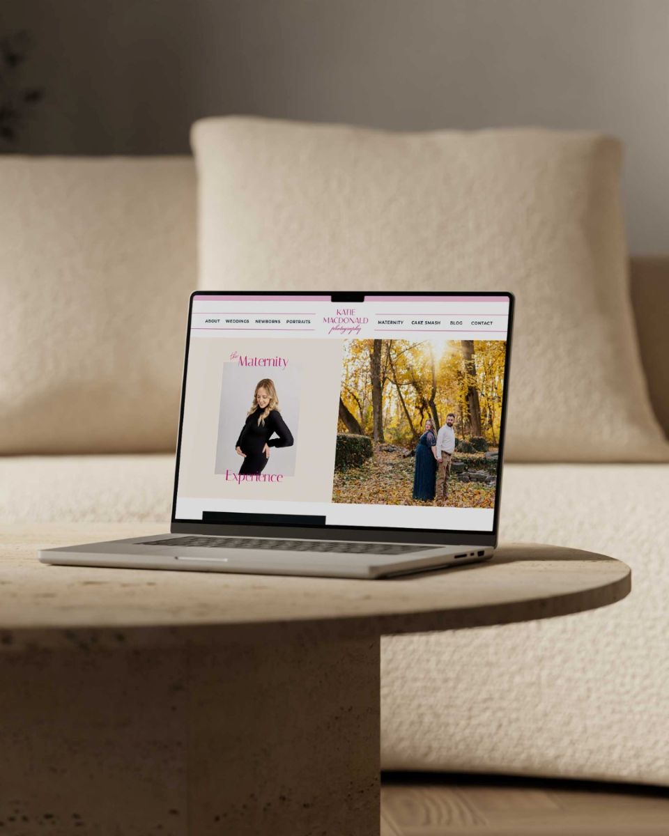 katie macdonald photography's website pulled up on a laptop that is resting on top a table and is next to a couch