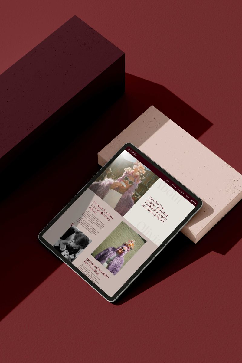 a tablet displaying olivia yuen photography's website set against a pink box