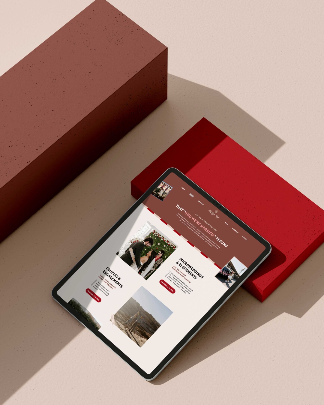 website page for katelyn faye photography dispalyed on a tablet set against a red box