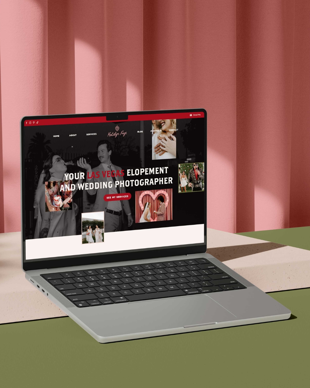website page for katelyn faye photography displayed on a laptop set against a white blcok white a pink curtain backdrop