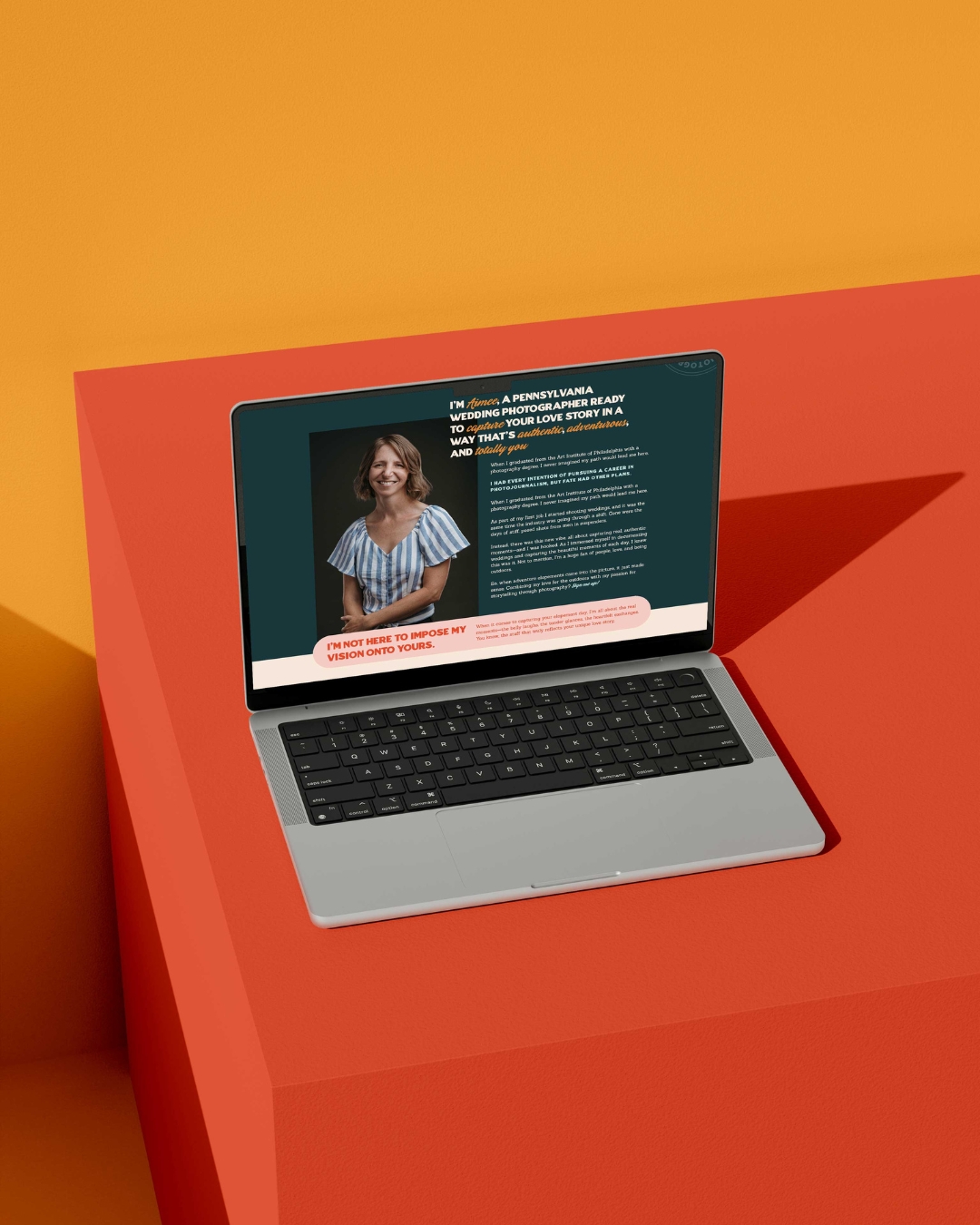 website for please for don't blink photography displayed on a laptop on top of an orange box 