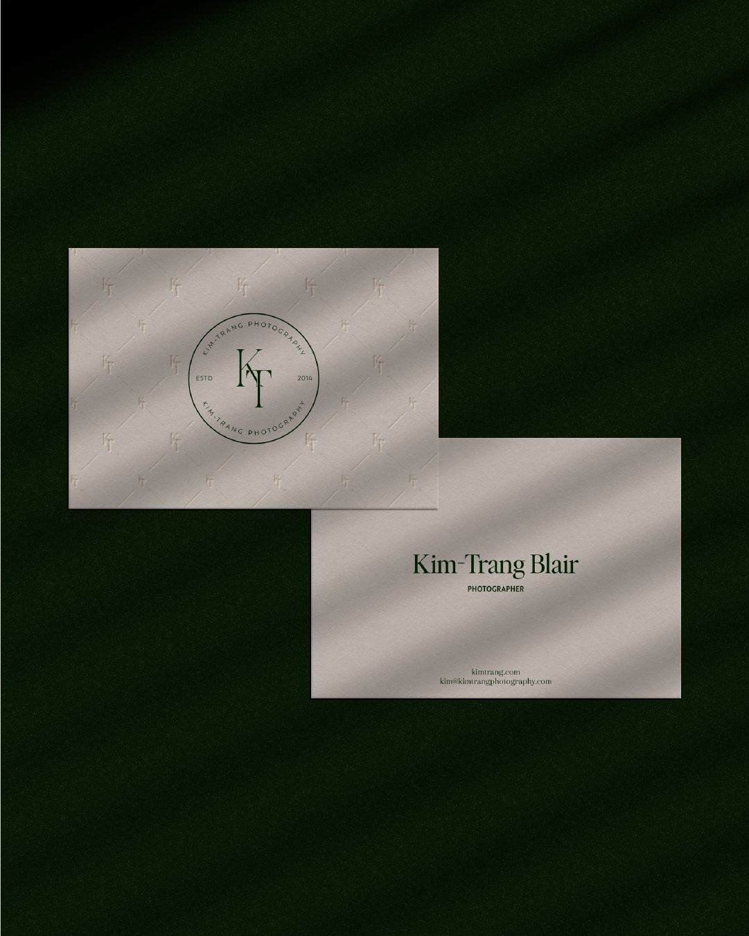 business cards for kim trang blair photography set against a black backdrop