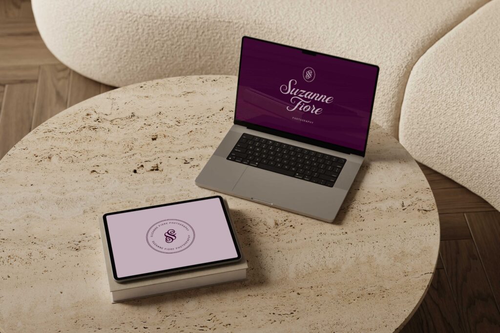 website for suzanne fiore photography displayed on a laptop and tablet sitting on top of a table 