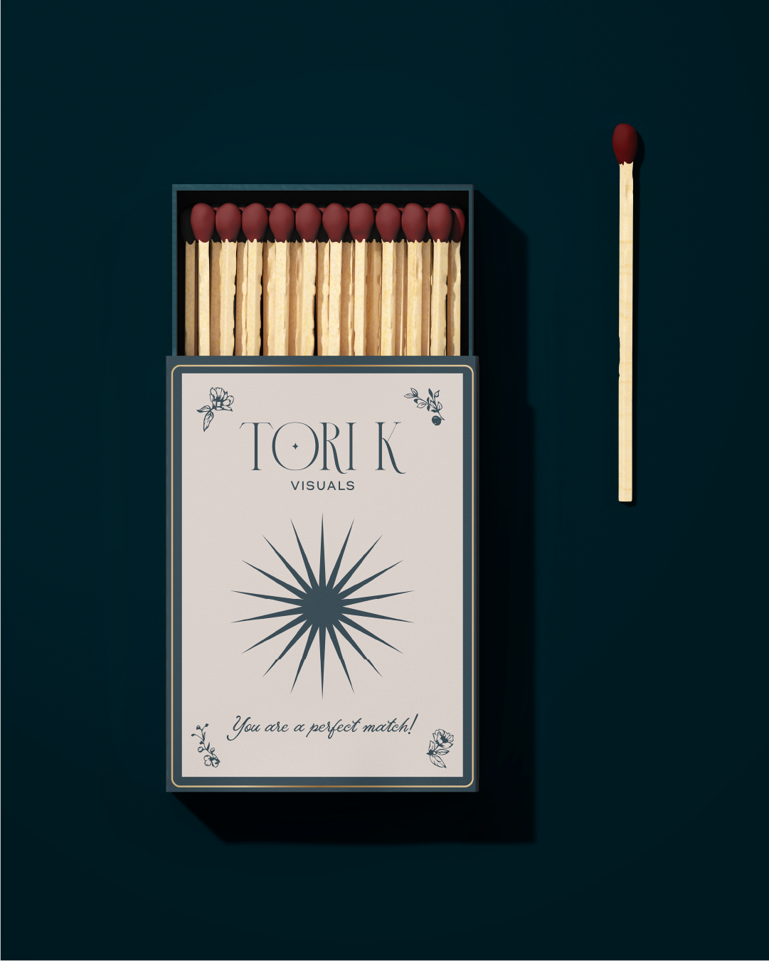 a matchbox with tori k visuals logo on it