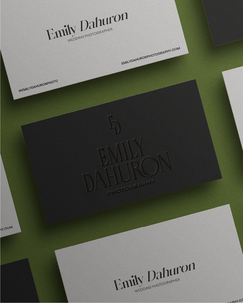 logos for emily dahuron photography on different business cards