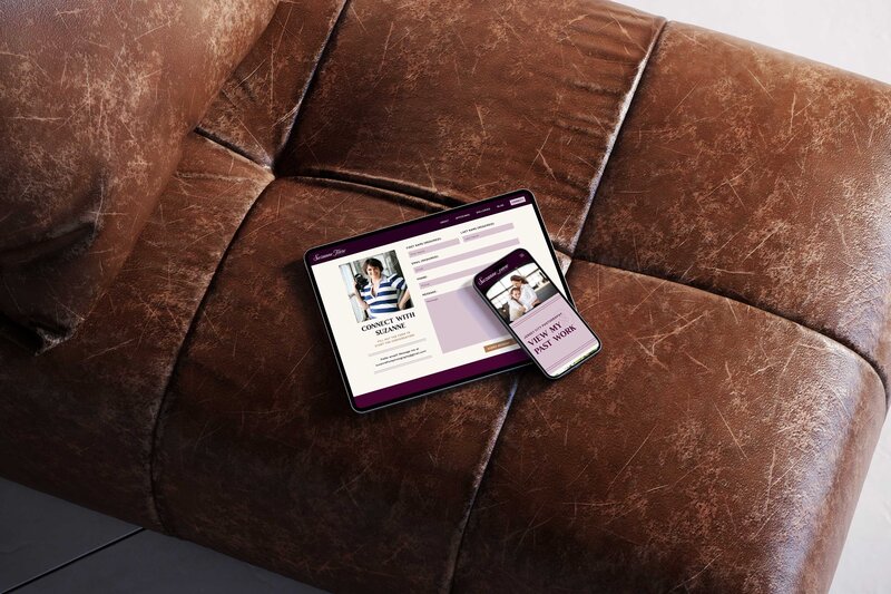 a tablet and a mobile phone on a leather couch 