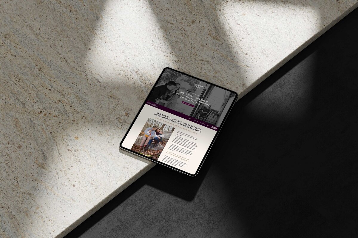 a tablet displaying the website for suzanne fiore photography