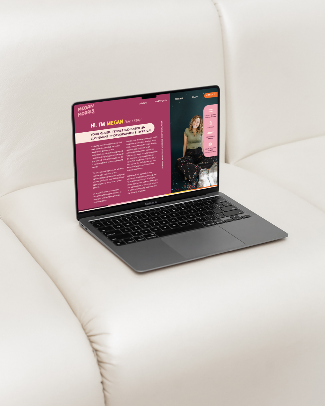 a laptop on top of a white couch displaying the website for megan morris photography