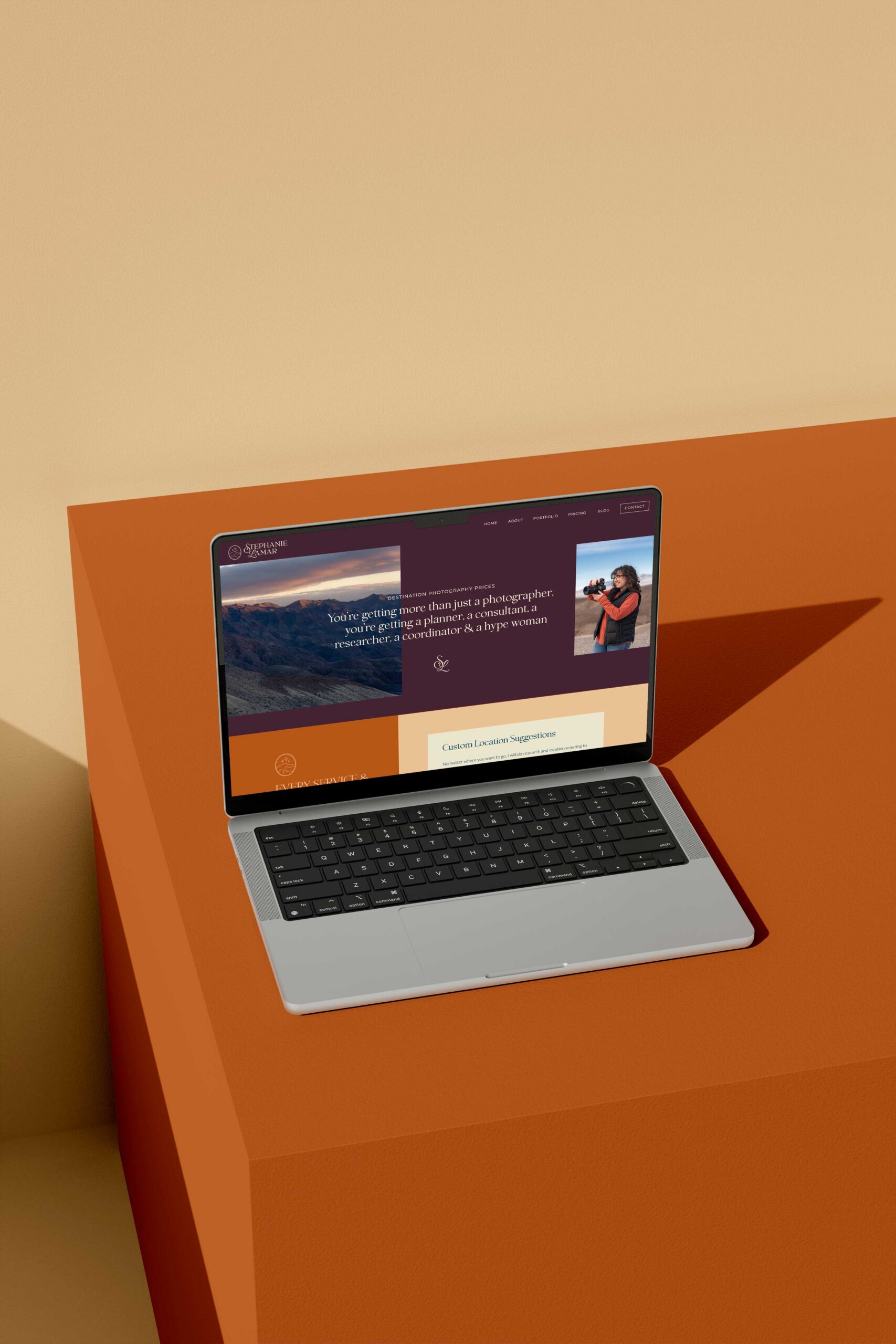 a laptop displaying the website for stephanie lamar photography