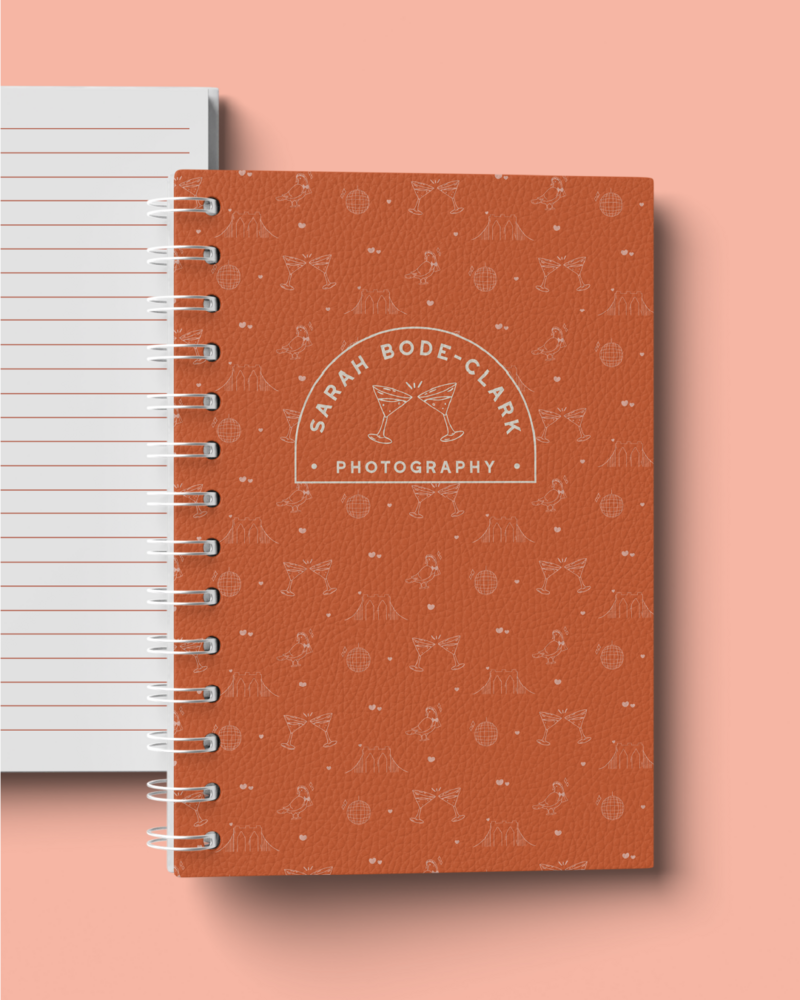 a logo for sarah bode clark photography on a journal 