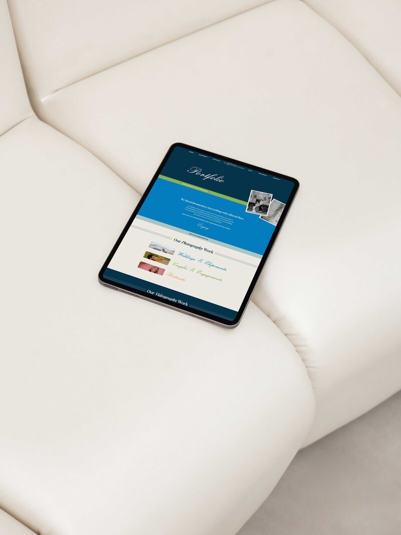 a tablet on a couch the tablet is showing the website page for combs creative 