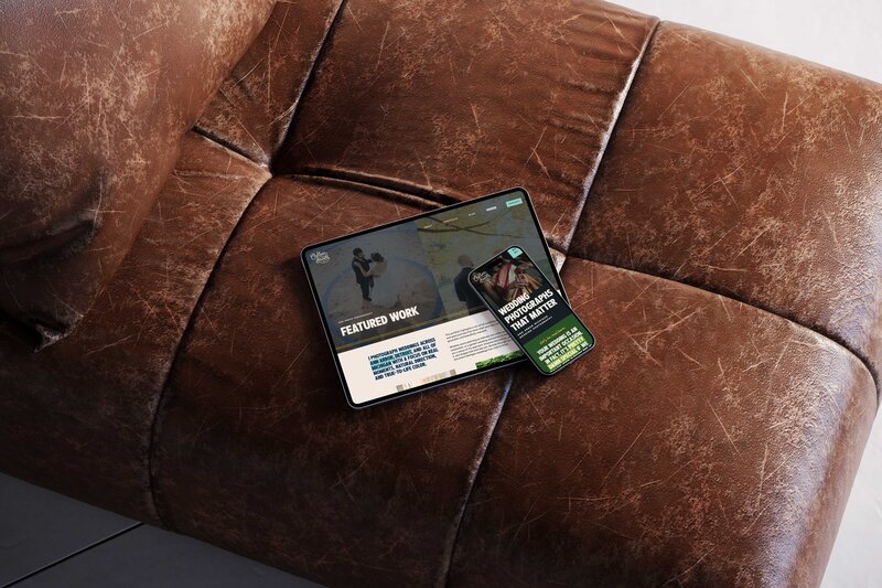 a tablet and mobile phone on a couch displaying the website for chelsea brown photography