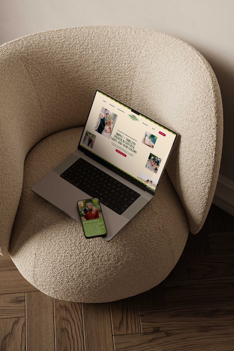 a laptop and mobile phone on a chair both displaying the website for niki robinson photography